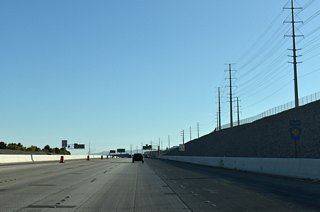 Confirming marker for southbound CC-215 (Bruce Woodbury Beltway) preceding Exit 28 to SR 613 east and Sunset Run Drive west.