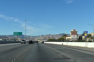 A split diamond interchange joins CC-215 with Durango Drive and Sunset Road in 1.25 miles.