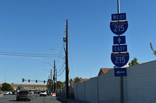 Warm Springs Road meets Interstate 215 at a parclo interchange south of Harry Reid International Airport (LAS) in unincorporated Paradise.