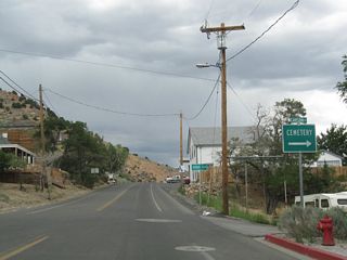 Northbound Nevada 341 meets Carson Street just ahead of a distance sign for Reno via Nevada 341 (Geiger Grade) to I-580/U.S. 395 north.