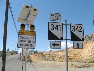 Southbound Nevada 341 (C Street) splits with Nevada 342 adjacent to the Fourth Ward School in Virginia City. Following Occidental Grade, Nevada 341 is the designated truck route south to U.S. 50.