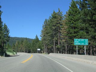 This mileage sign provides the distance to U.S. 395 and I-580 (24 miles), Reno (35 miles via Interstate 580 and U.S. 395), and Virginia City (38 miles via Nevada 341).