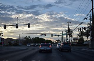 The continuation of Sunset Road turns west at the intersection with S Mountain Vista Street and Sunset Way.