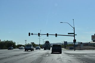 Eastgate Road heads south from an industrial area east of Interstate 11 to meet SR 564 across from Fiest Henderson Boulevard north.