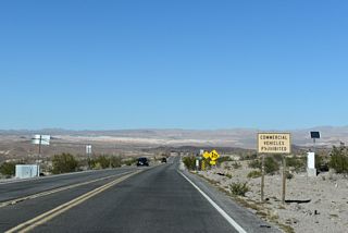 Commercial vehicles are prohibited from the remainder of Lake Mead Parkway as the highway enters Lake Mead National Recreation Area.
