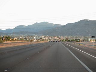 Cadence Crest Avenue east and Mohawk Drive north come together at the succeeding traffic light along SR 564 (Lake Mead Parkway) west.