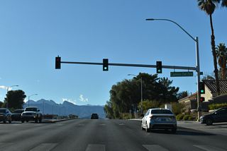 Camino Del Oro weaves south from Lone Mountain Road through the Rancho Alta Mira neighborhood to intersect Craig Road across from Ivory Circle.
