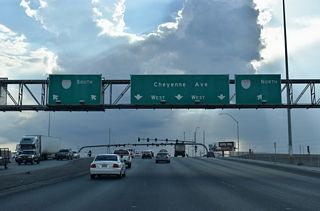 SR 574 (Cheyenne Avenue) enters a SPUI with I-15/U.S. 93 west of Civic Center Drive.