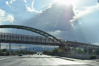 A pedestrian bridge spans Cheyenne Avenue as part of the Lower Las Vegas Wash Trail.