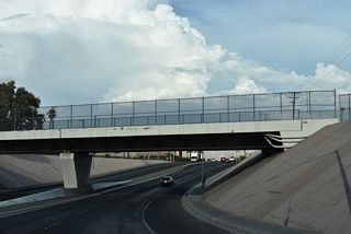 Washington Avenue makes an S-curve below a Union Pacific Railroad line.
