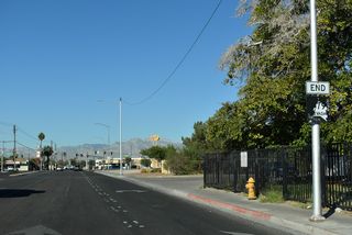 An end shield for SR 579 west precedes the intersection joining Bonanza Road with SR 599 (Rancho Drive).