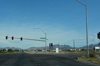State maintenance concludes along Boulder Highway south at Tulip Falls Drive. The six lane arterial intersects Gibson Road nearby.
