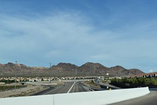 Boulder Highway ties into the intersection joining Wagon Wheel Drive with Old Vegas Trail adjacent to the diamond interchange with Interstate 11.