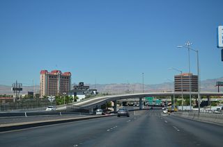 A flyover links I-15 south with Sahara Avenue east back to The Strip as part of the parclo interchange joining SR 589 with the Las Vegas Freeway.