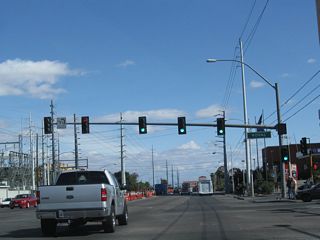 Eastbound Flamingo Road meets Koval Lane at this traffic signal. Koval Lane provides access to the back of the casino-resorts on the east side of Las Vegas Boulevard, including Bally's, Paris, Planet Hollywood, and MGM Grand. A large Nevada Power substation is located at the north side of the intersection.