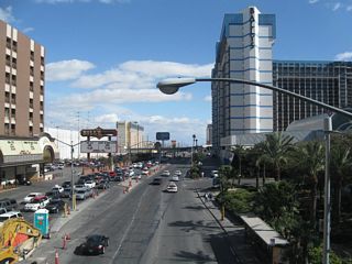 This view looks east along Flamingo Road from the pedestrian overpass on the east side of Las Vegas Boulevard. Bill's casino and the towering Flamingo resort are on the left (north) side of the street, while Bally's and Paris are on the south side.