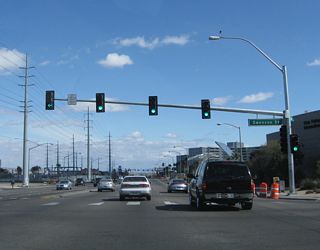 Eastbound Flamingo Road (Nevada 592) approaches the intersection with Swenson Street.