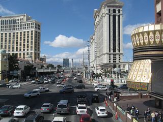 Westbound Flamingo Road (former Nevada 592) meets Las Vegas Boulevard at this traffic signal. Like the intersection between Las Vegas Boulevard and Tropicana Avenue (former Nevada 593), pedestrian traffic is routed onto skybridges that pass over the intersection. On the southwest corner is the Bellagio; on the northwest corner is the Caesar&apos;s Palace.