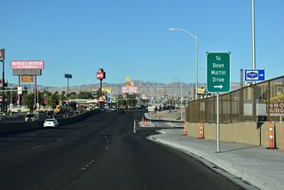 Westbound SR 593 concludes at Dean Martin Drive (former Industrial Road) just beyond Interstate 15. Tropicana Avenue continues west across the unincorporated community of Spring Valley to CC-215 (Bruce Woodbury Beltway).