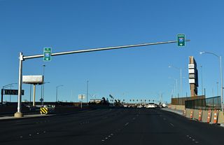 Underway from 2022 to Fall 2025, the I-15 Tropicana Interchange Project expanded Tropicana Avenue with triple left turn lanes for respective I-15 entrance ramps, realigned Dean Martin Road, and constructed new bridges.
