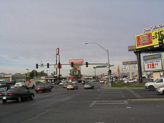 Westbound Nevada 593 comes to its end here, at the intersection with Dean Martin Drive (former Industrial Road) just west of Interstate 15 and west of the Las Vegas Strip. Tropicana Avenue continues west toward the unincorporated community of Spring Valley before connecting with the 215/Bruce Woodbury Las Vegas Beltway.