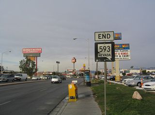 An end shield for SR 593 is posted at the northwest corner of the intersection joining Tropicana Avenue with Dean Martin Drive.