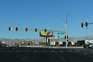 Tropicana Avenue west next intersects Polaris Avenue. The Spring Mountains west of Las Vegas are visible on most days from westbound Tropicana Avenue.