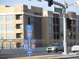 I-215 arcs southeast from the Fish Bowl interchange to Green Valley and Henderson. CC-215 (Bruce Woodbury Beltway) extends west between Spring Valley and Enterprise.