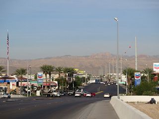 SR 594 (Russell Road) passes over Dean Martin Drive, the west service road for I-15, ahead of the state route end at Polaris Avenue.