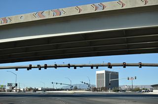 A single point urban interchange (SPUI) connects SR 595 (Rainbow Boulevard) with I-11/U.S. 95.