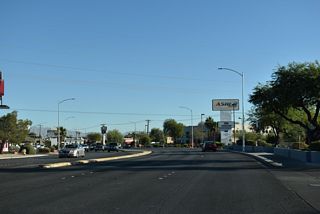 Jones Boulevard northbound shifts east through an S-curve ahead of Charleston Boulevard.