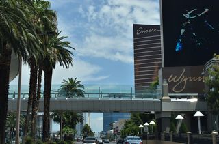 A pedestrian bridge spans Las Vegas Boulevard to connect the Wynn Las Vegas resort and Fashion Show Mall just beyond Spring Mountain Road west / Sands Avenue east.