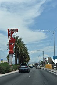 The vintage Bow & Arrow Motel neon sign stands within the median of Las Vegas Boulevard north of Wilson Avenue.