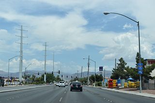 An Interstate 15 trailblazer precedes SR 573 (Craig Road) on SR 610 (Lamb Boulevard) northbound. SR 573 connects with the freeway 1.1 miles to the west, as does SR 610 to the north.