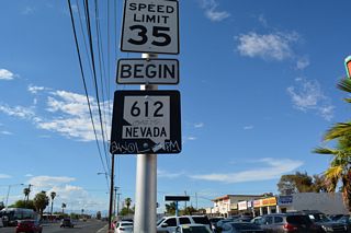 A begin SR 612 shield appears north of SR 593 (Tropicana Avenue) along Nellis Boulevard.