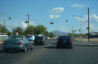 Flashers operate at the four-way stop sign intersection joining Nellis Boulevard with Sun Valley Drive near Ullom Elementary School.