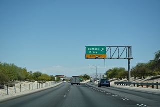 Buffalo Drive meets SR 613 (Summerlin Parkway) at a parclo interchange. Buffalo Drive heads south to Tropicana Avenue and north to Washburn Road.