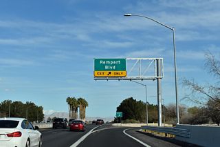 Rampart Boulevard heads north to The Pueblo and South Shores neighborhoods of Summerlin and south to Charleston Boulevard (old SR 159) at Boca Park shopping center, east of Queensridge.