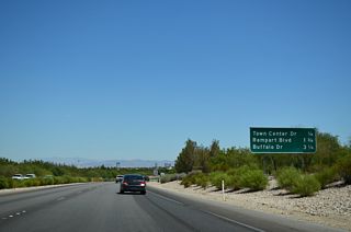 Summerlin Parkway passes under Crestdale Lane one quarter mile west of the diamond interchange with Town Center Drive.