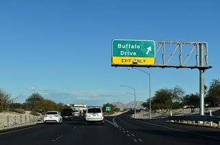 Buffalo Drive meets SR 613 (Summerlin Parkway) at a parclo interchange. Buffalo Drive heads south to Tropicana Avenue and north to Washburn Road.