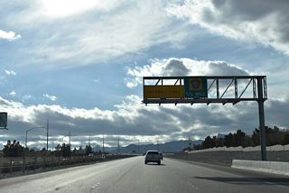 An auxiliary lane accompanies Summerlin Parkway west to the northbound entrance ramp for CC-215 to U.S. 95 (Oran K. Gragson Freeway).
