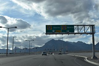 Clark County Route 215 constitutes a three-quarter beltway encircling the Las Vegas metropolitan area along with I-215 from Henderson to I-15 near Las Vegas Motor Speedway. The freeway passes through Summerlin north to Sun City and south to The Gardens neighborhood.