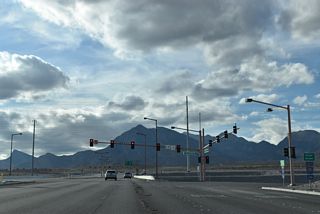 Signalized intersections connect ramps on both sides of the Bruce Woodbury Beltway with the west end of SR 613 (Summerlin Parkway).