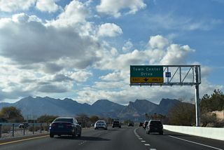SR 613 (Summerlin Parkway) curves northwest between the TPC Canyons and TPC Summerlin Golf Courses to next meet Town Center Drive.