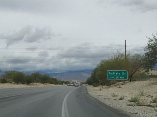 Completed by 2012, expansion of Summerlin Parkway added HOV connections from U.S. 95 to the four lane freeway at Buffalo Drive. This scene looks at the former traffic pattern ahead of the parclo interchange with Buffalo Drive. Buffalo Drive is a suburban arterial between Sahara Avenue (old SR 589) and Gowan Road.