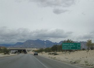 This interchange sequence sign was replaced to reflect the Durango Drive off-ramp, located one mile ahead. The ensuing exits (Rampart Boulevard, Town Center Drive, and Anasazi Drive) fall within the community of Summerlin.