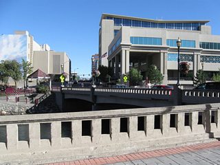Looking south from the north bank of the Truckee River at the Sierra Street crossing, old bridge railing lines the River Walk.
