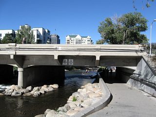 Arlington Avenue crosses the Truckee River in Wingfield Park; this view looks northeast at the bridge from pedestrian walkway in the park.