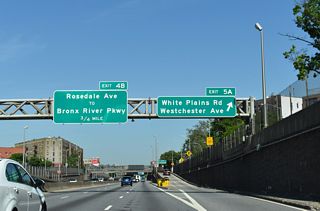 Exit 5 A ascends onto the adjacent Cross Bronx Expressway Service Road ahead of Westchester Avenue. Westchester Avenue ties into Hugh J. Grant Circle above Interstate 95.