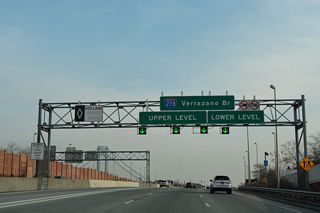 Tolls for the Verrazano Bridge eastbound are collected at an AET gantry located just beyond the separation for the upper and lower levels of the suspension bridge.